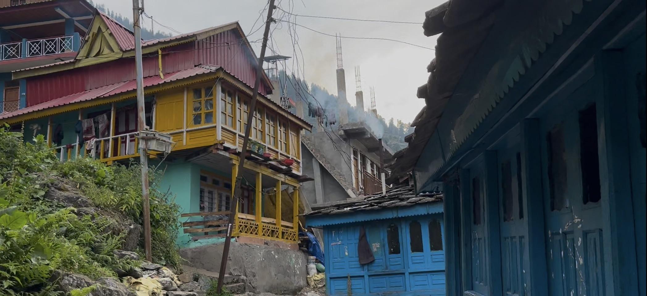 Colourful wooden houses with slate roofs in the village